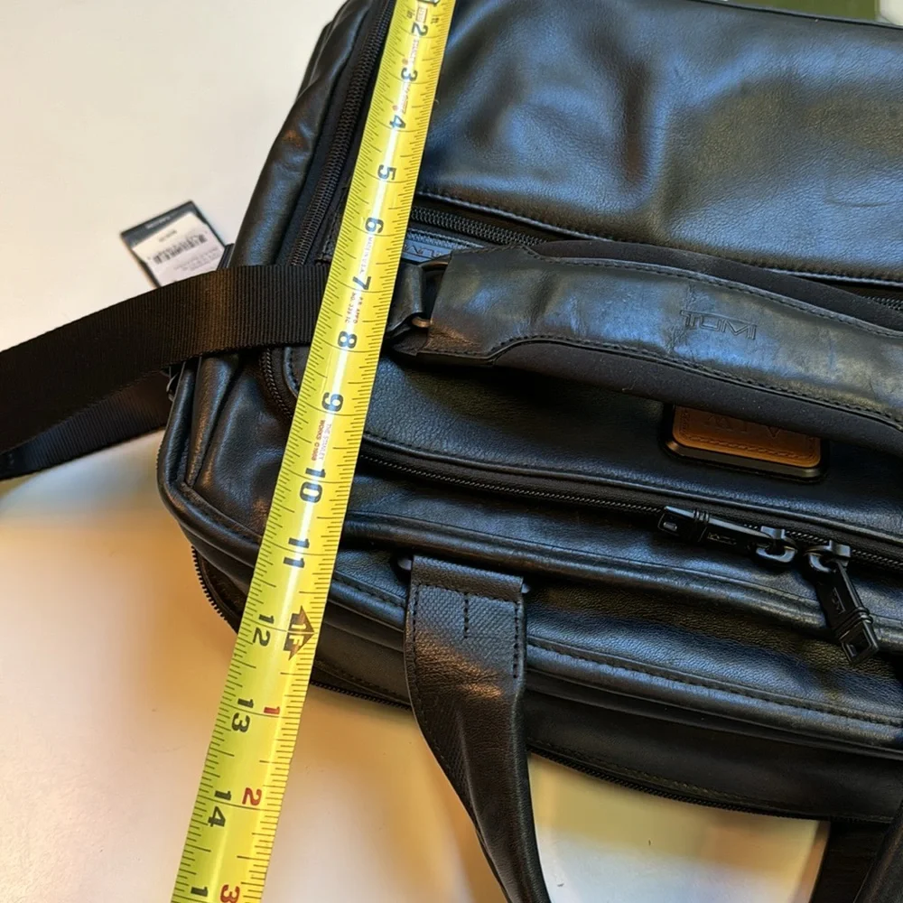 TUMi black leather computer briefcase carry-on VGC long strap multiple pockets